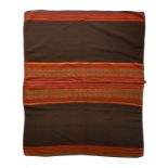 A Peru blanket with central bands of geometric and scroll decoration, 123cm x 101cm.