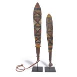 Two Aboriginal dance wands Tiwi Islands, Australia with pigment decoration, one with a dyed fibre