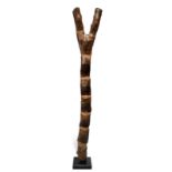 A Dogon ladder Mali 165.5cm high, on a base. (2) Provenance Owen Hargreaves, London. Richard