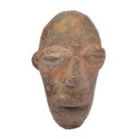 A Djenne head Mali terracotta, with elliptical eyes and an open mouth, 8cm high.