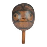 A Haida rattle section Northwest Coast the hollowed top with a painted bear head and with a demi-