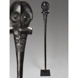 A Marquesas Island U'u club Polynesia with relief carved tiki heads, ribbed eyes and geometric