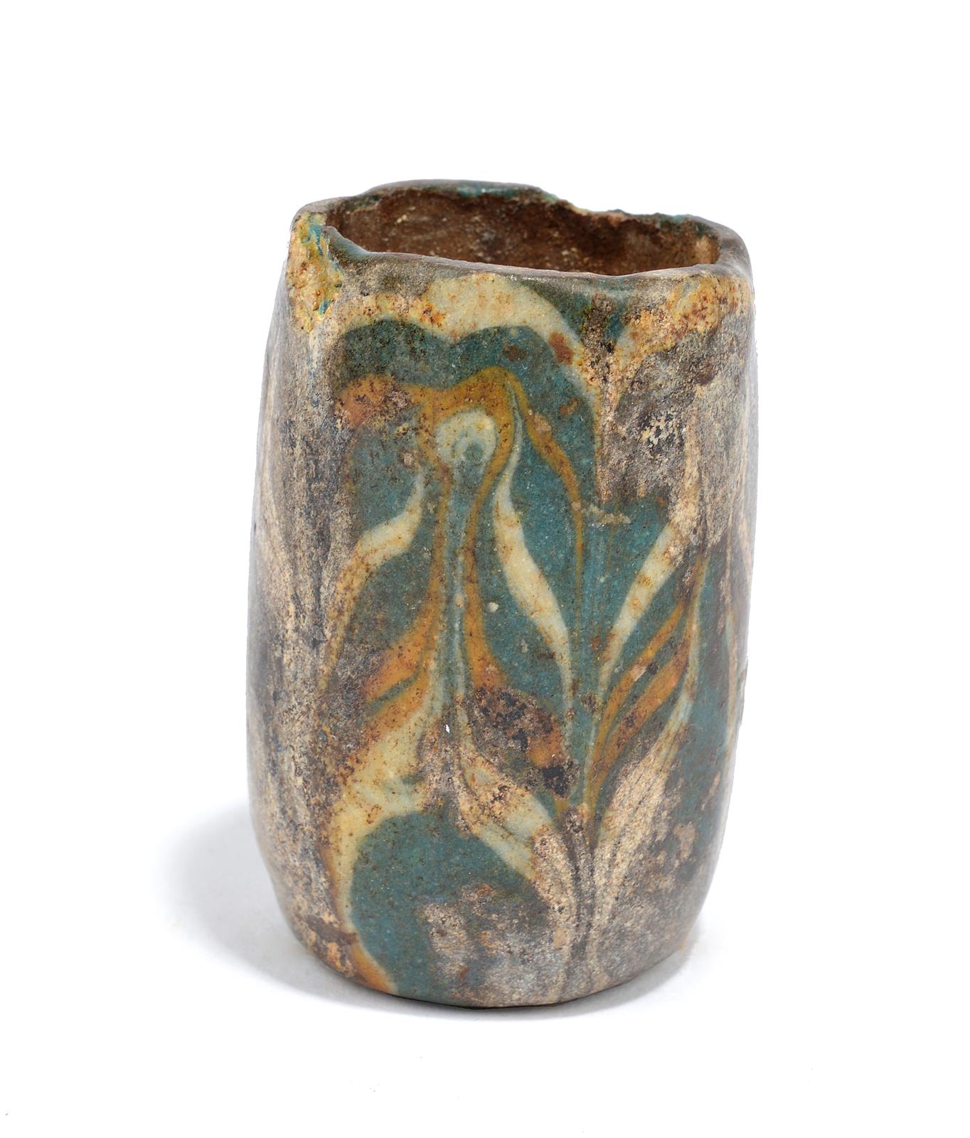 An Egyptian fragmentary core-formed glass vessel New Kingdom, 18th - 19th Dynasty, circa 1550 - 1185