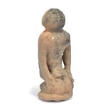 A Mississipian Culture kneeling female figure probably circa 800 - 1600 AD earthenware, with a
