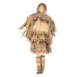 An Apache doll Arizona cloth, buckskin, hide, coloured glass beads, fibre and tin cones, with blue