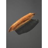 λA Punuk culture woman's knife ulu Alaska, circa 500 - 1000 AD walrus ivory and slate, the handle