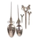 Three Bolivia double headed cloak pins tupu silver coloured metal and bronze, including two heads