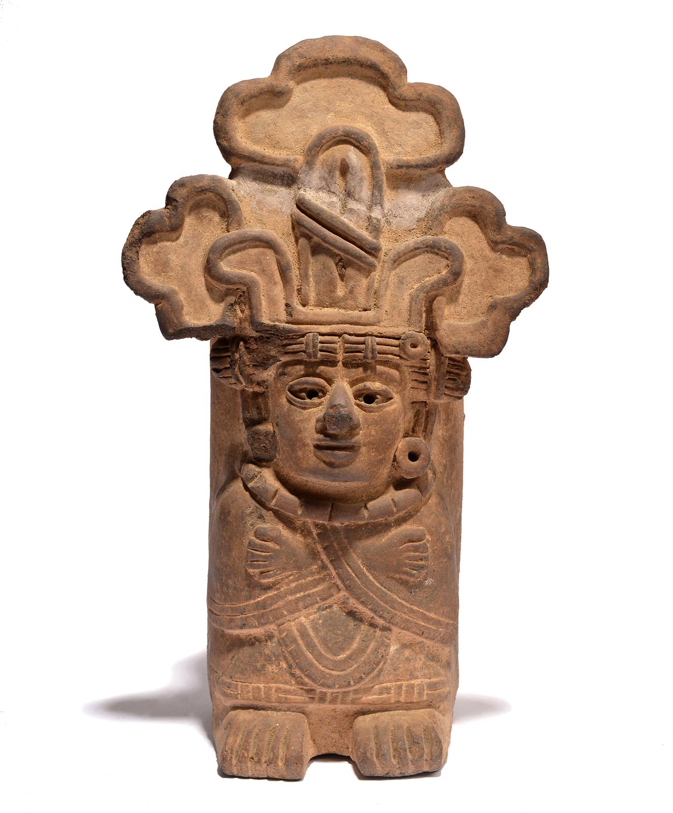 A Zapotec figural urn Mexico, circa 550 - 750 AD earthenware, wearing a headdress, disc earring