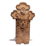 A Zapotec figural urn Mexico, circa 550 - 750 AD earthenware, wearing a headdress, disc earring