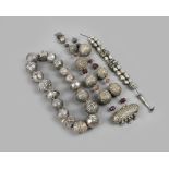 A Yemen hirz necklace silver coloured metal, with large beads, a prayer container and resin, 78cm