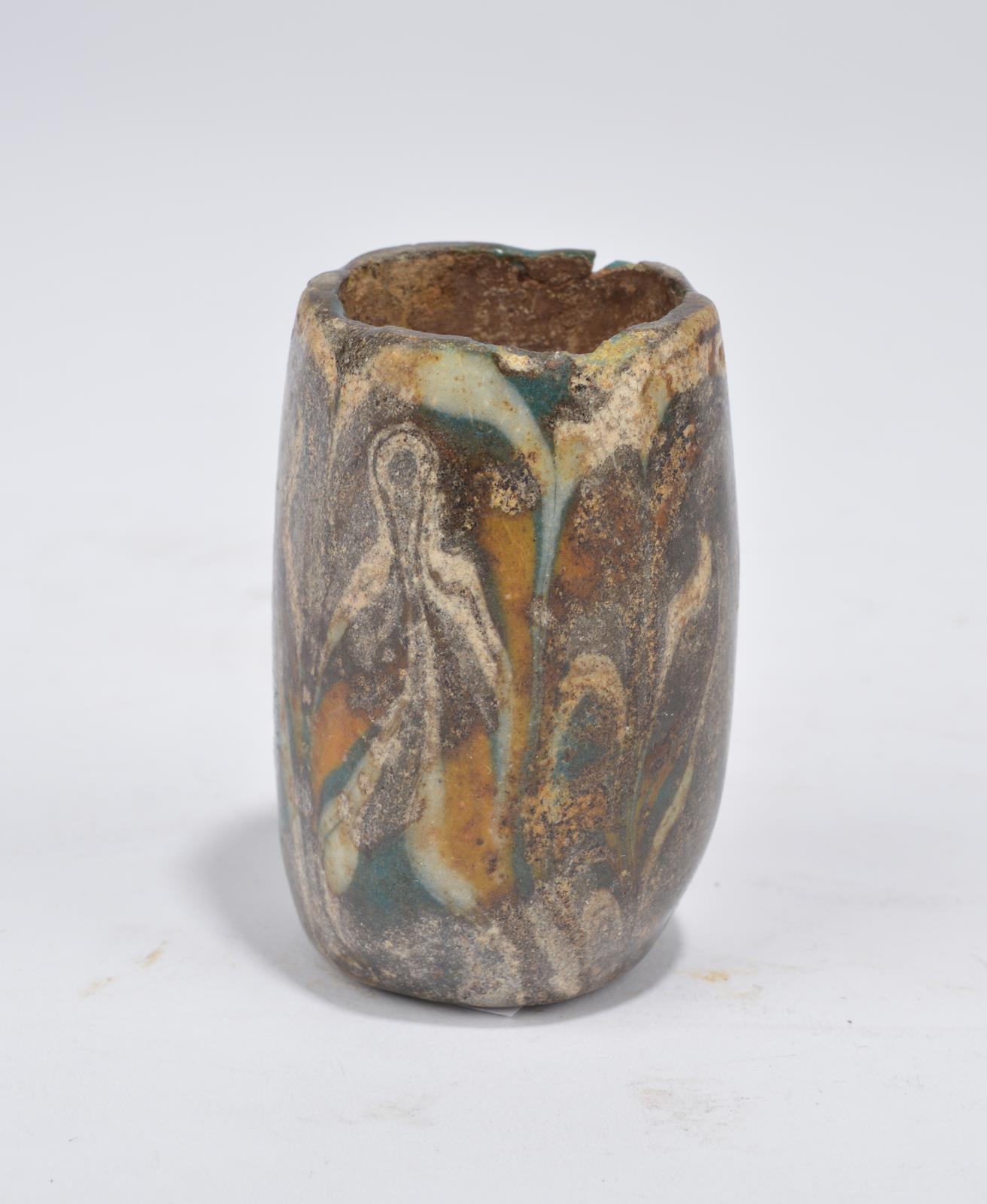 An Egyptian fragmentary core-formed glass vessel New Kingdom, 18th - 19th Dynasty, circa 1550 - 1185 - Image 2 of 3