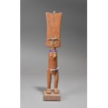 A Fante doll Ghana with incised linear decoration to the back of the head and with beads, 29.5cm