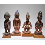 Four Yoruba Ibeji figures Nigeria including two male and two female, one male with body