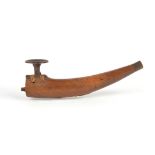 An Inuit pipe Alaska wood, steel, brass with sinew binding, with a detachable plug end, the centre