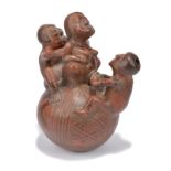 An Ecuador birth vessel terracotta with linear and geometric decoration and with a birthing group,