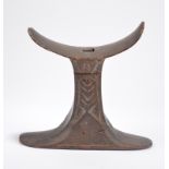 An Egyptian carved headrest New Kingdom, circa 1550 - 1069 BC in two parts with a tenon join to