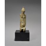 A Djenne figural finial Mali bronze of a kneeling female with large eyes and abdominal