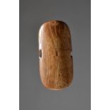 A Punuk culture wrist guard Alaska, circa 500 - 1000 AD antler, with linear decoration and a
