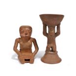 A Narino seated coca chewing female figure Colombia earthenware with an aperture to the head and