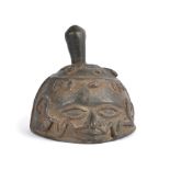 A Benin bell Nigeria bronze, cast an Oba's face with two snakes from the nose, with crescent and