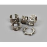 Two Egyptian bracelets silver coloured metal, with oblong and round relief decoration, with