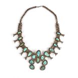 A Navaho squash blossom necklace Southwest North America silver coloured metal and turquoise,