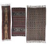 A Sumba Songket Indonesia woven with two standing ancestor figures 190cm x 86.5cm, with a Flores