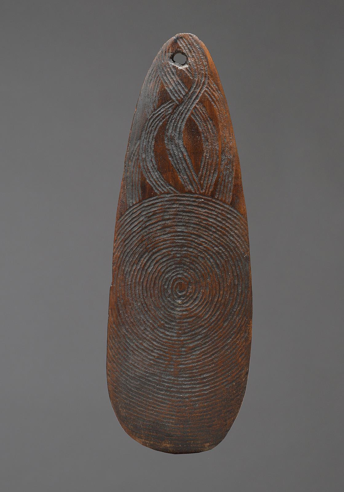 An Aboriginal churinga Australia with fine linear carved decoration ...