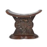 A Shona headrest Zimbabwe the top with carved triangles and zig-zags on a pierced and carved support