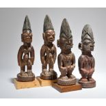Two pairs of Yoruba Ibeji male figures Nigeria one pair with filed front teeth and penis' missing,