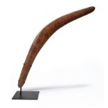 An Aboriginal boomerang Australia with carved decoration of flowerheads and leaves, 72cm long, on