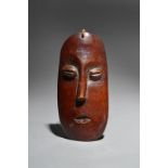 λA Lega mask Democratic Republic of the Congo ivory, early to mid 20th century, 17cm high.