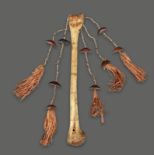 An Admiralty Islands dance wand Melanesia animal femur bone with incised hatch decoration, the end
