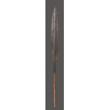 A Maasai blade Kenya iron, with a central rib and a socket end with a short wood handle, 101.5cm