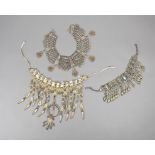 λA Yemen necklace silver coloured metal with coral beads, 37.5cm long, a Libyan necklace, gilt-metal