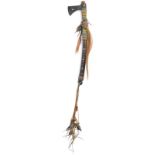 A Plains ceremonial tomahawk the iron blade with a open heart motif to a leather and glass bead