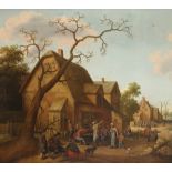 Joost Cornelisz Droochsloot (Dutch 1586-1666) Village scene with figures at a table outside a