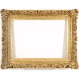 A 19th Century Continental giltwood and gesso frame With corner cartouches, scroll and acanthus leaf