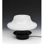 A Vistosi glass table lamp, the black glass base supporting opaque white glass mushroom shade,
