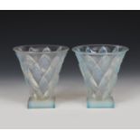 A pair of Sabino opalescent glass vases, flaring conical form on square feet, modelled in relief