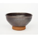 ‡ William Staite Murray (1881-1962) a stoneware footed bowl, covered to the foot with a rich brown