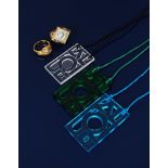 A Modern Lalique green glass pendant, rectangular pierced and cast with Lalique motif, on green