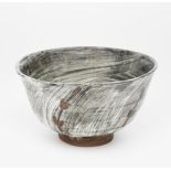 ‡ William 'Bill' Marshall (1923-2007) a stoneware footed bowl, brushed grey Hakeme glaze splashed