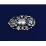 A Georg Jensen silver brooch designed by Georg Jensen, model no.89, pierced and cast with