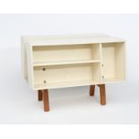 An Isokon Penguin Donkey II designed by Ernest Race, designed in 1963, cherry wood legs with white