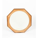 A Barnsley Workshops circular bevelled English walnut wall mirror, the octagonal frame inlaid with