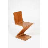 An oak Zig Zag chair designed by Gerrit Thomas Rietveld, manufactured by H.G.M Gerard van de