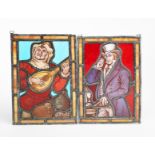 A small Aesthetic Movement stained glass Minstrel panel, rectangular depicting a minstrel playing