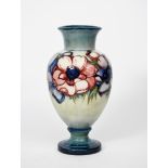 'Anemone' a Moorcroft Pottery baluster vase designed by William Moorcroft, painted in shades of