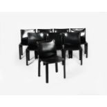 A set of eight Cassina Cab black leather chairs designed by Mario Bellini, and a Zanotta anodised